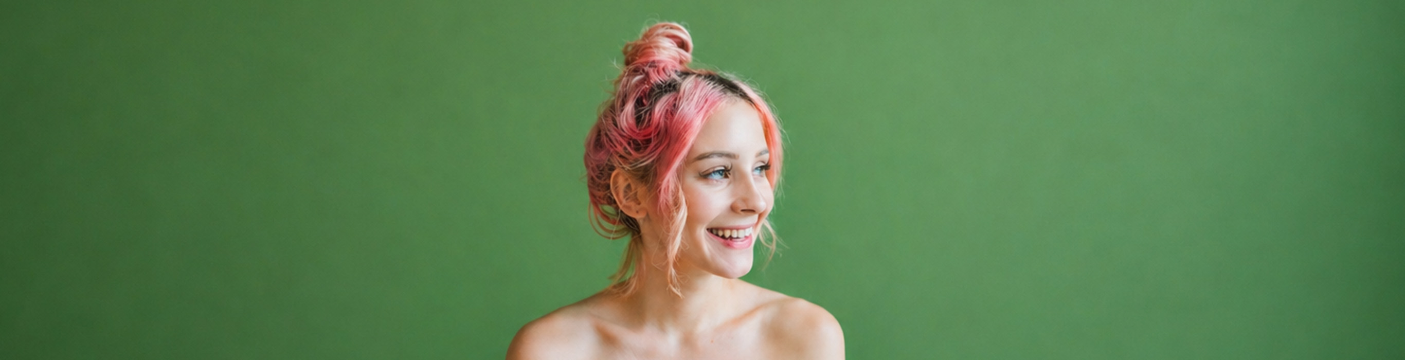 Woman with soft pink hair, illustrating healthy-looking colour refreshed without damaging the hair.